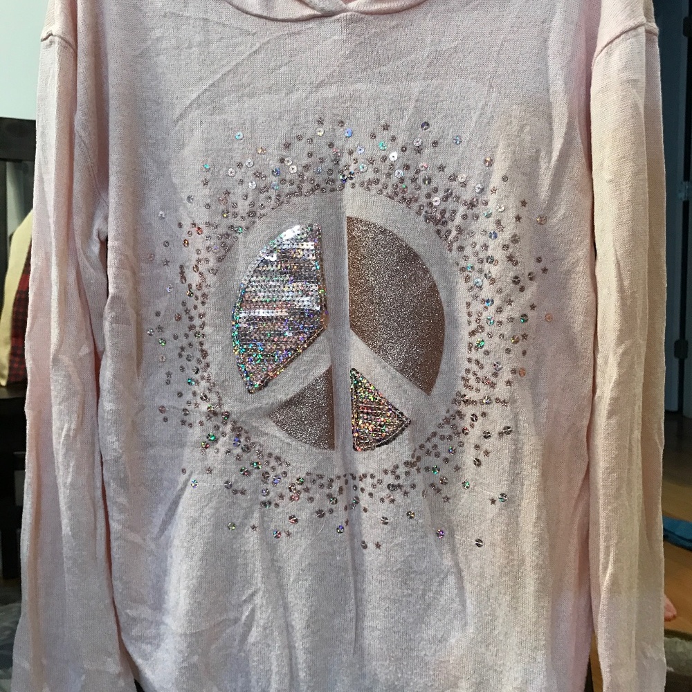 Girl’s soft spun long sleeve shirt with hood. Size 10/12. Sparkle peace sign